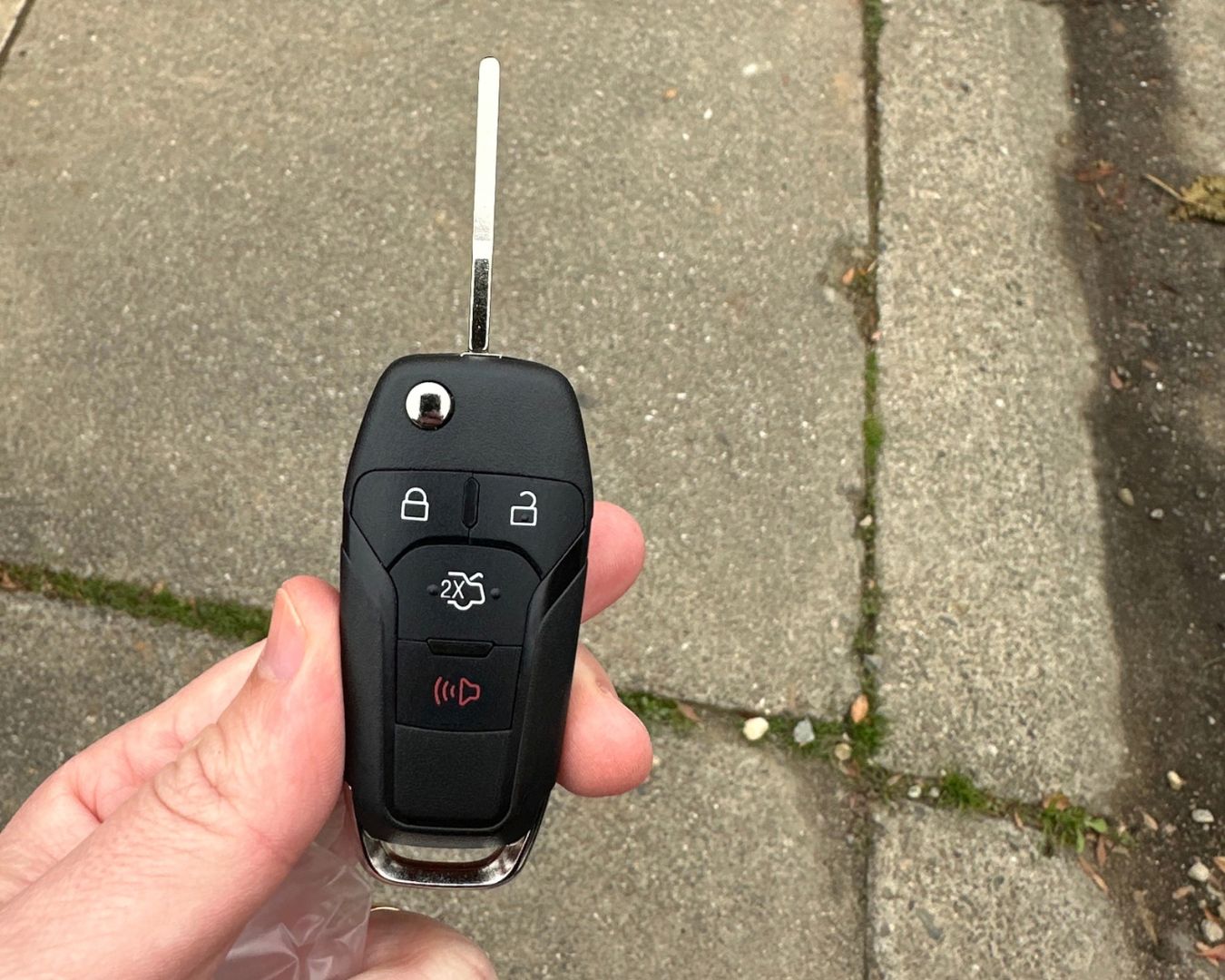 Remote flip key with its blade extended, made for a 2012 Ford Focus after the keys were lost.